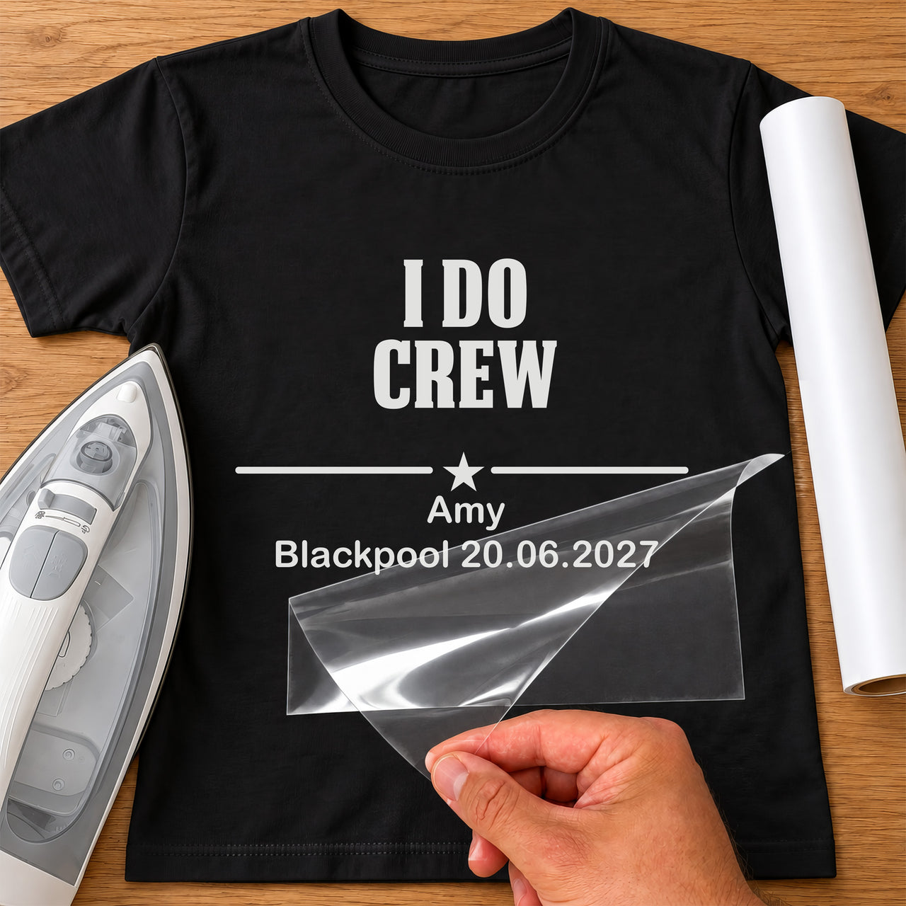 Black T-shirt with white 'I DO CREW', star divider, 'Amy', 'Blackpool 20.06.2027' iron-on, iron and white vinyl
