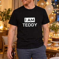 I Am Name Iron-On Transfer, shown on a black t-shirt