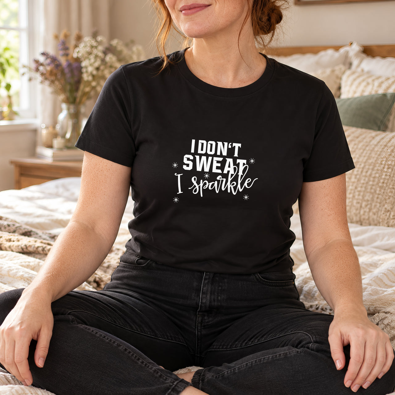 Black T-shirt with the I Don't Sweat I Sparkle design printed on the chest