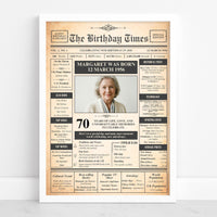 White framed 70th birthday front page poster with a portrait of a smiling grey haired woman, name and 1956 birth date