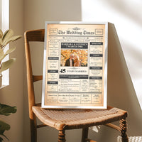 Framed 45th anniversary newspaper print on a wooden wicker chair in sunlight, showing a couple photo and names