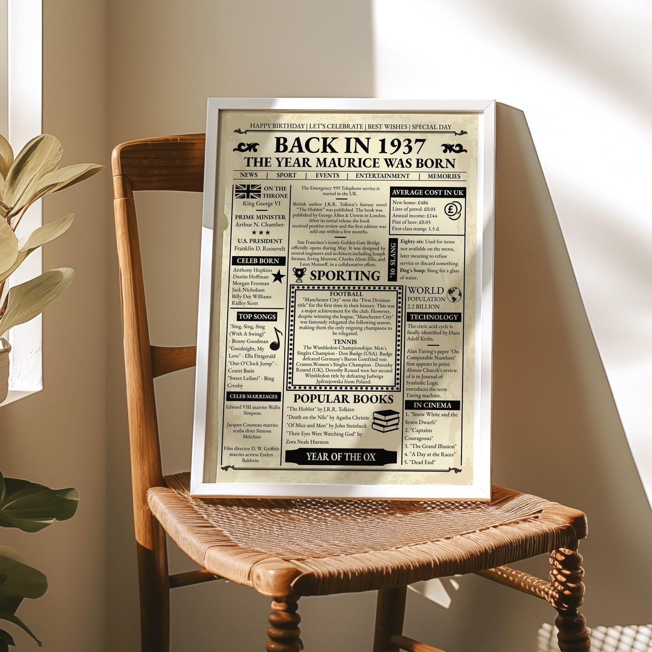 Framed 1937 front page print on a woven wooden chair in warm window light next to a houseplant