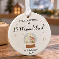 New home ceramic bauble: round, snow globe with a cottage and stars, First Christmas at 15 Main Street, Nur & Caleb