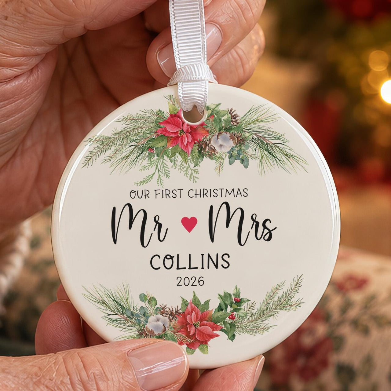 First Christmas married bauble: ceramic ornament with poinsettia and pine sprays, Mr, a red heart, Mrs and Collins 2026