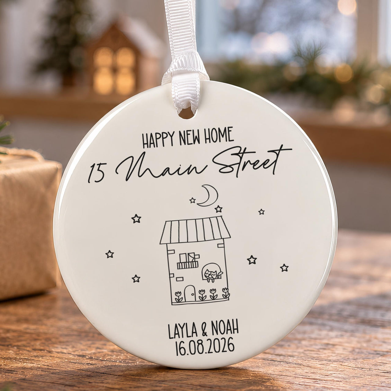 House number ceramic bauble: line-drawn house under moon and stars, Happy New Home 15 Main Street, Layla & Noah 16.08.2026