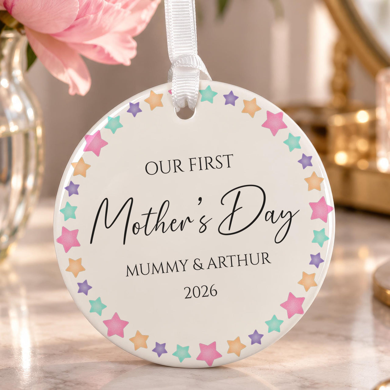 First Mother's Day ornament: ceramic disc with a pastel star border and Our First Mother's Day, Mummy & Arthur 2026
