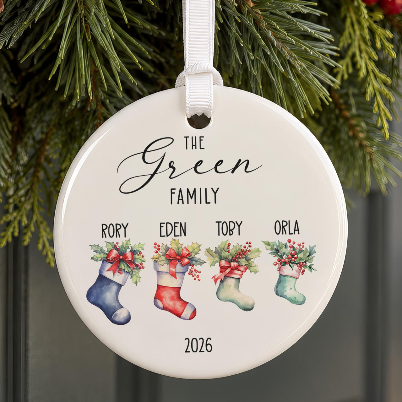 Family Christmas bauble: ceramic ornament with The Green Family, four stockings named Rory, Eden, Toby, Orla and 2026