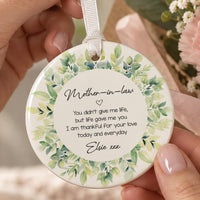 Mother in Law ceramic ornament: round bauble with a green watercolour leaf wreath, a short thank-you verse and Elsie xxx