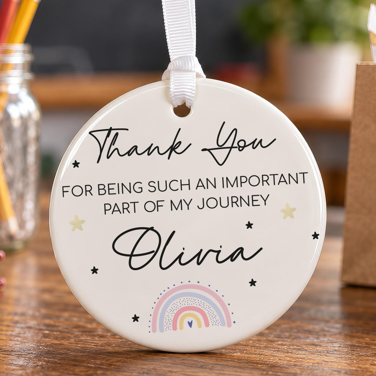 Thank-you ceramic bauble with a pastel rainbow and stars: Thank You for being such an important part of my journey Olivia