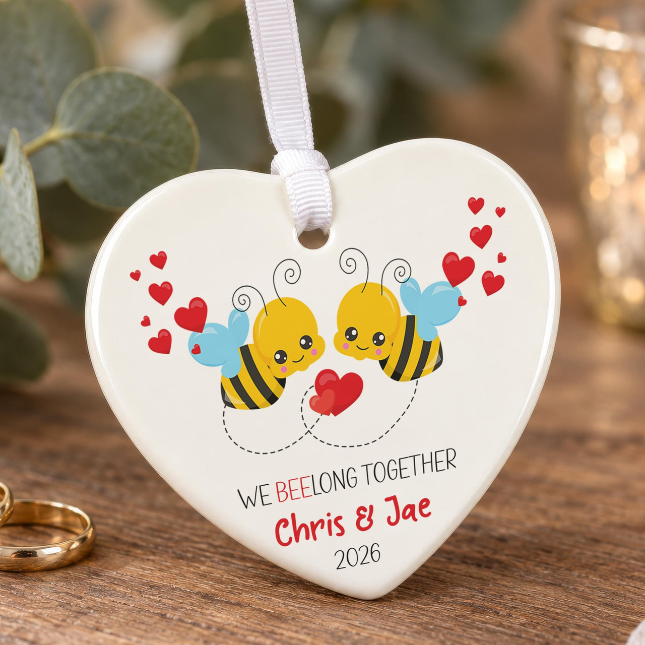 Bumble bee ceramic heart ornament: two cartoon bees with red hearts, We Beelong Together, Chris & Jae, 2026