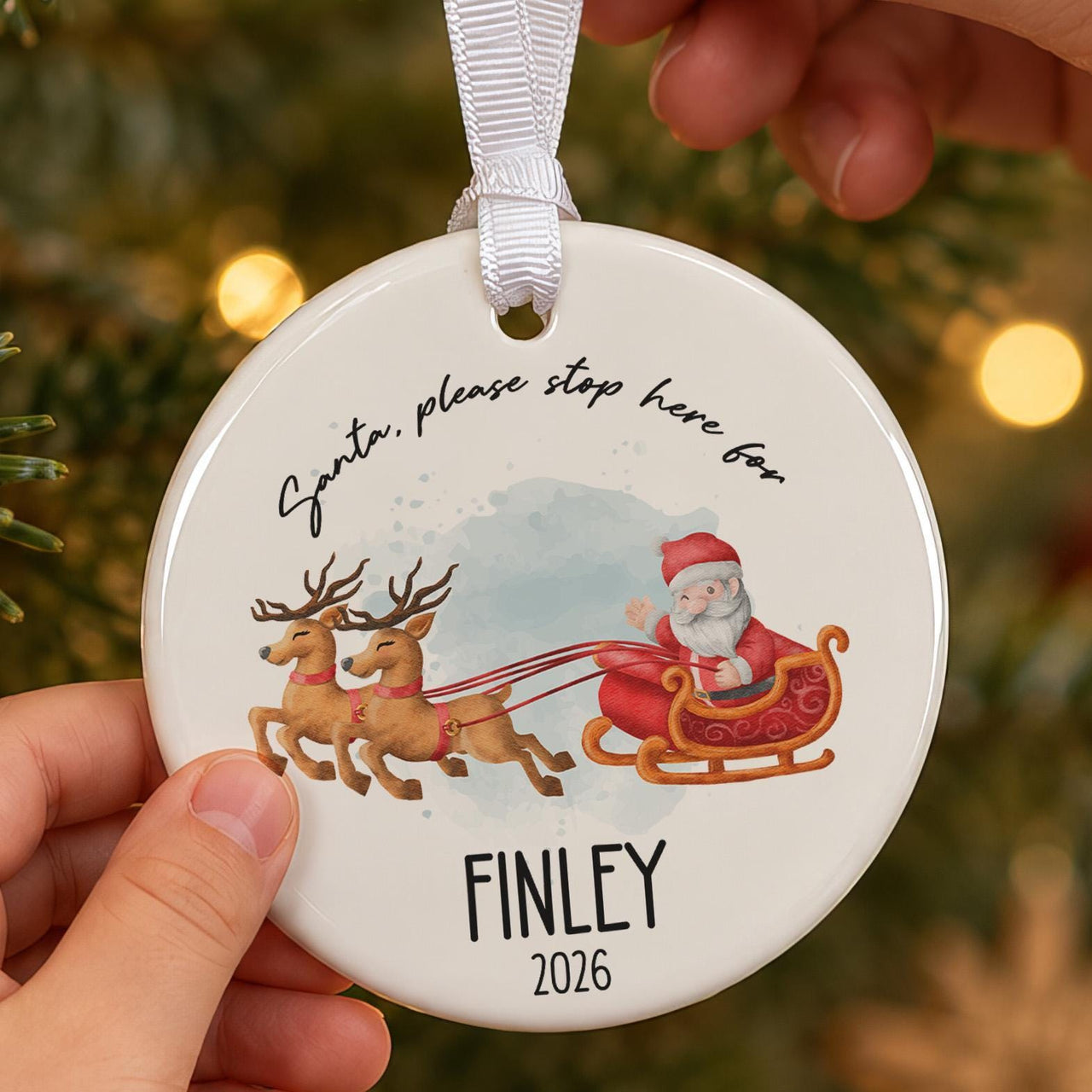 Santa Stop Here ceramic bauble: round, Santa in sleigh with two reindeer, Santa, please stop here for Finley 2026