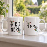 Personalised hummingbird mugs: two white mugs, one reading BIRD NERD and one EMMA, with watercolour hummingbirds