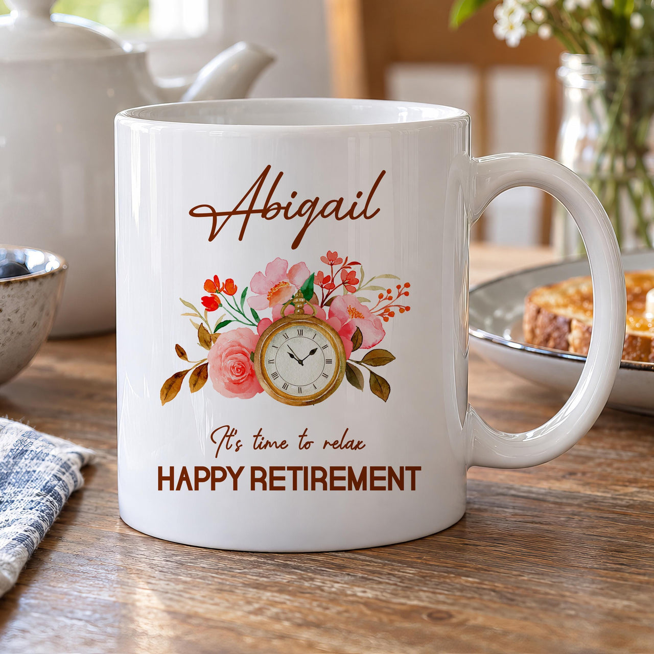 Retirement mug: white mug with Abigail in script, a gold pocket watch in pink flowers, It's time to relax, Happy Retirement