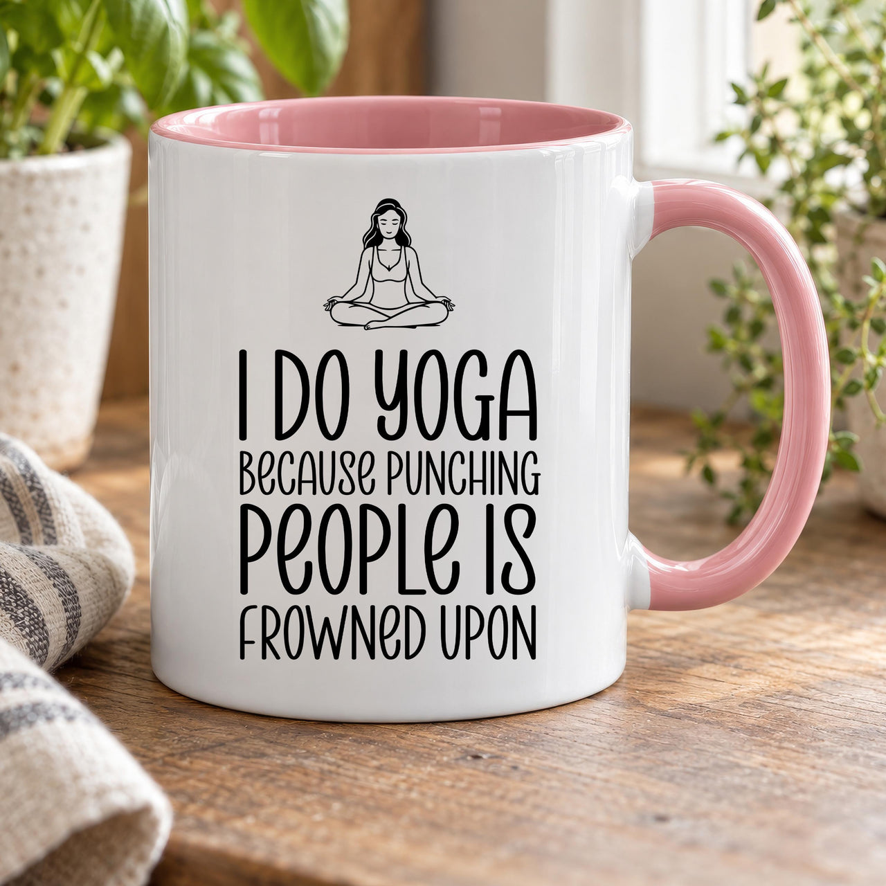Funny yoga mug: pink-handled mug with a meditating woman and I DO YOGA BECAUSE PUNCHING PEOPLE IS FROWNED UPON