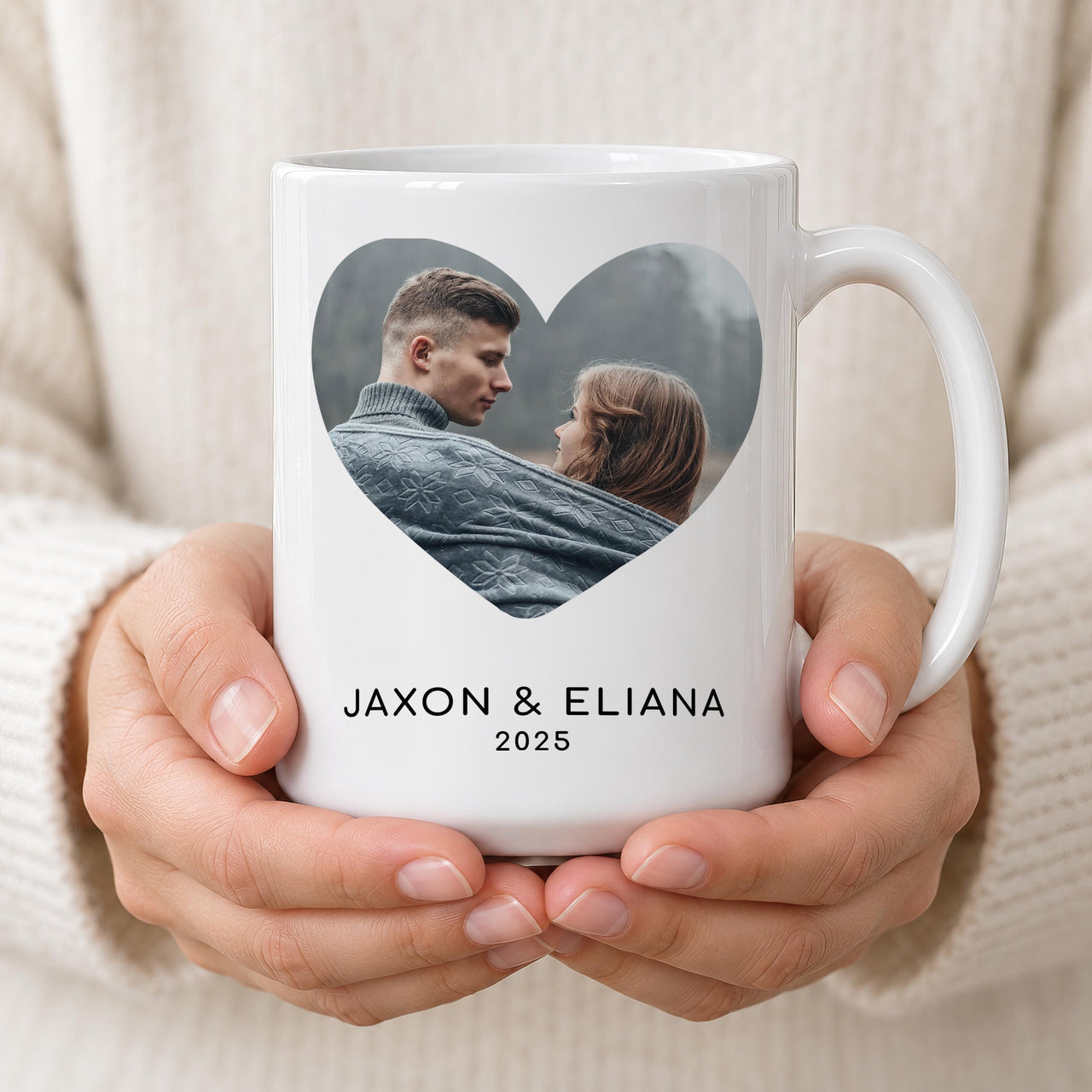 Two hands holding a white 15oz heart photo mug