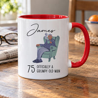 75th birthday mug: white mug with red handle, an old man in an armchair, the name James and 75 Officially a Grumpy Old Man
