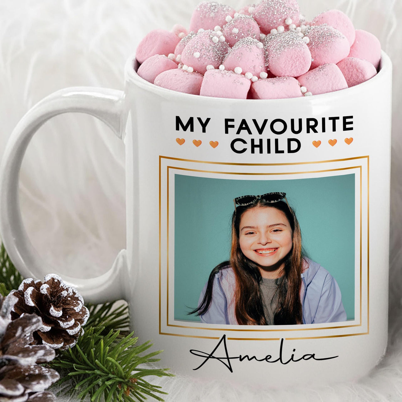 Personalised favourite child mug: white mug with MY FAVOURITE CHILD, a gold-framed photo of a girl and Amelia in script