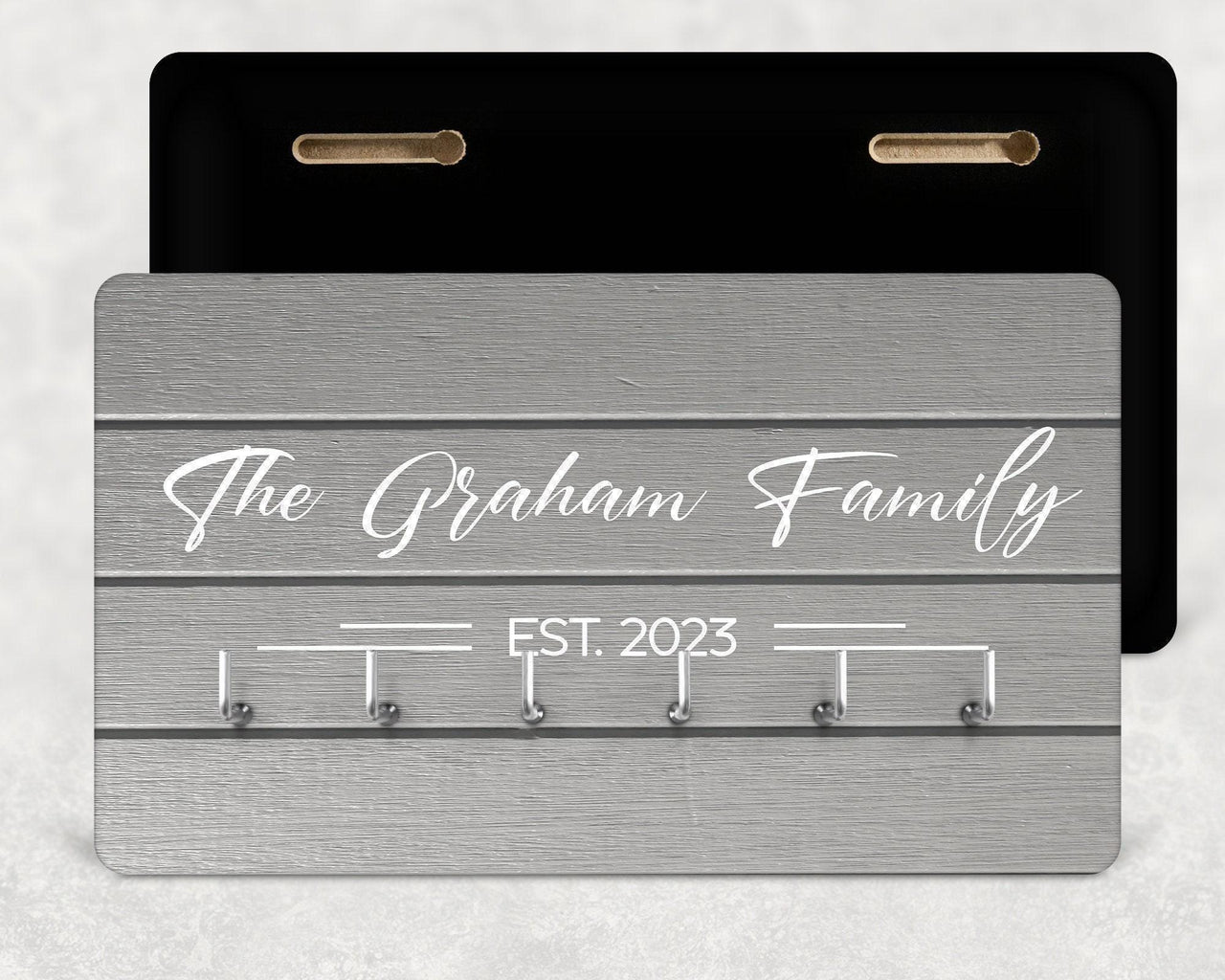 Grey wood-effect key rack with white script "The Graham Family", "Est. 2023" and six hooks - personalised key holder