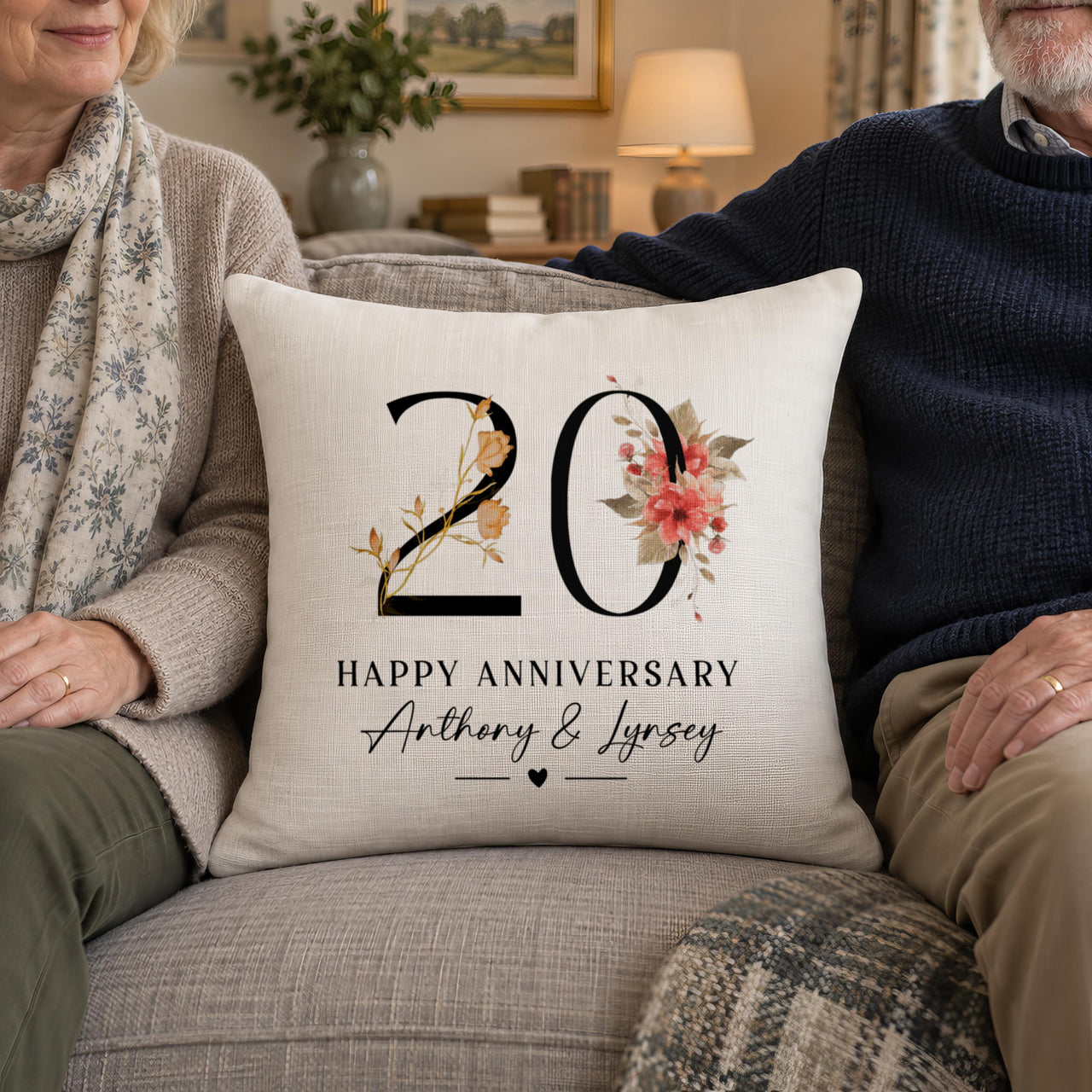 Linen cushion with floral '20', 'HAPPY ANNIVERSARY' and 'Anthony & Lynsey' between an older couple - personalised cushion