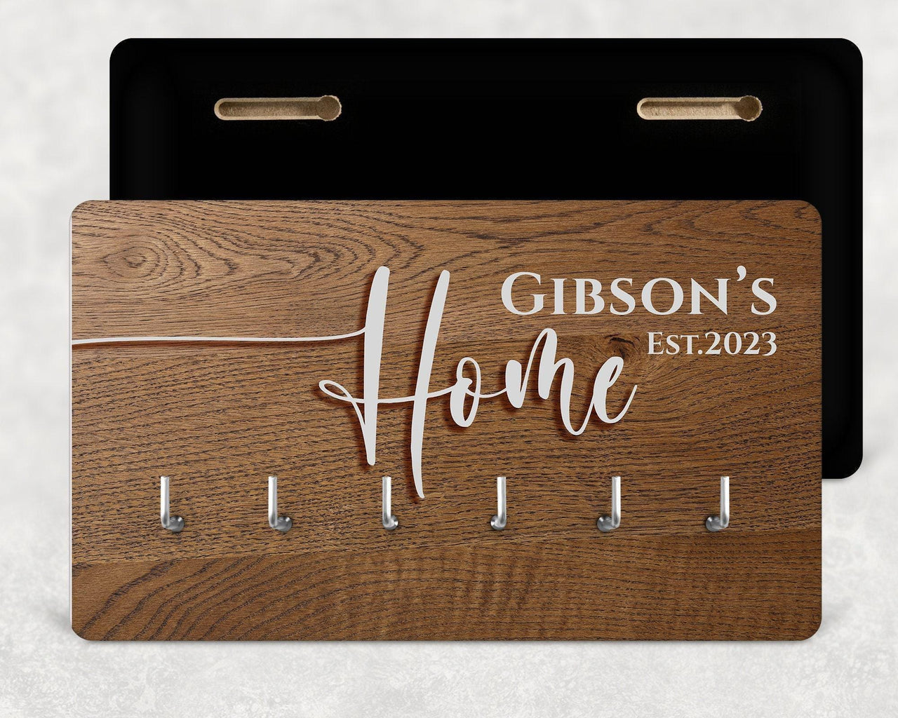 Wood-effect key rack with six hooks, white "Gibson's Home Est.2023" text, black back panel shown - personalised key holder