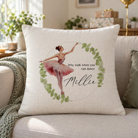 Cream cushion with a ballerina in a pink tutu inside a leaf wreath, the quote Why walk when you can dance and the name Millie