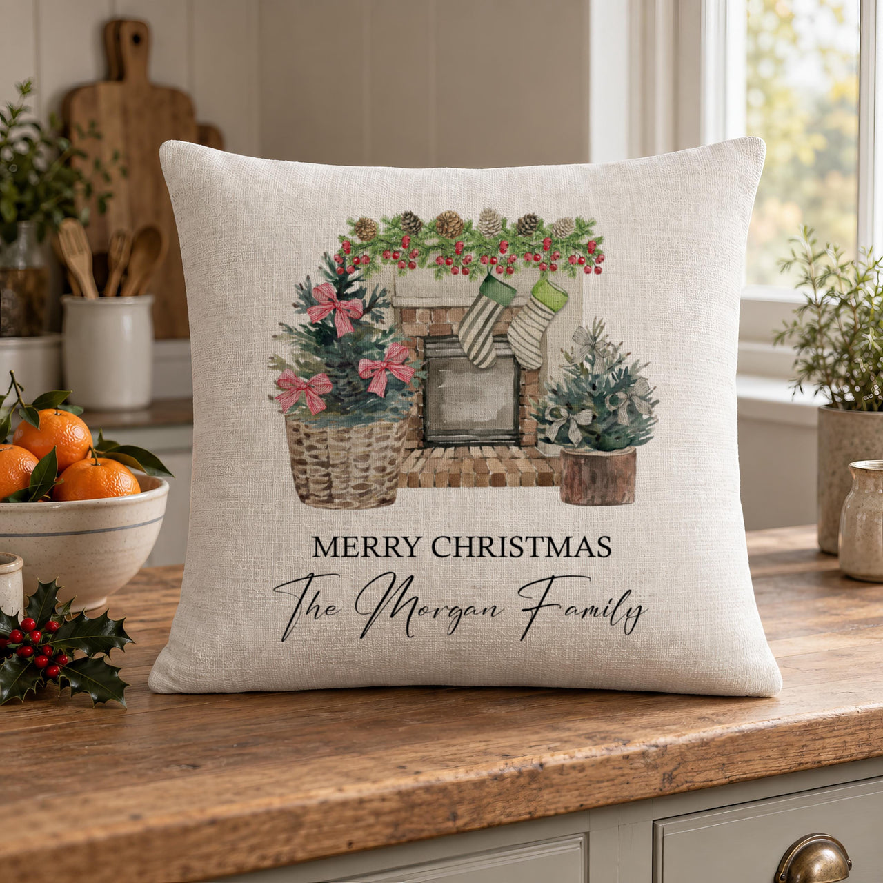 Linen-look cushion on a worktop with watercolour fireplace, "Merry Christmas The Morgan Family" - personalised cushion