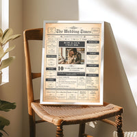 Silver framed anniversary newspaper poster on a wooden rush seat chair in warm sunlight