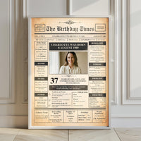 Large white framed 1989 photo front page poster leaning against a panelled wall on a wooden floor
