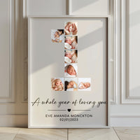 Large framed number 1 baby photo collage print leaning against a panelled wall on a wooden floor
