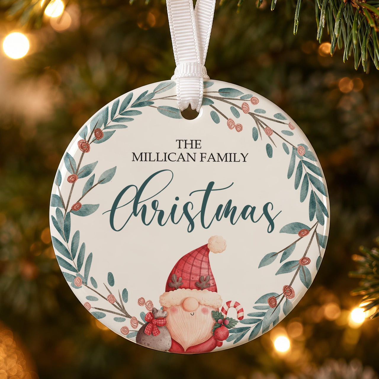 Gonk ceramic bauble: round, gonk in red hat inside a leafy berry wreath, The Millican Family Christmas