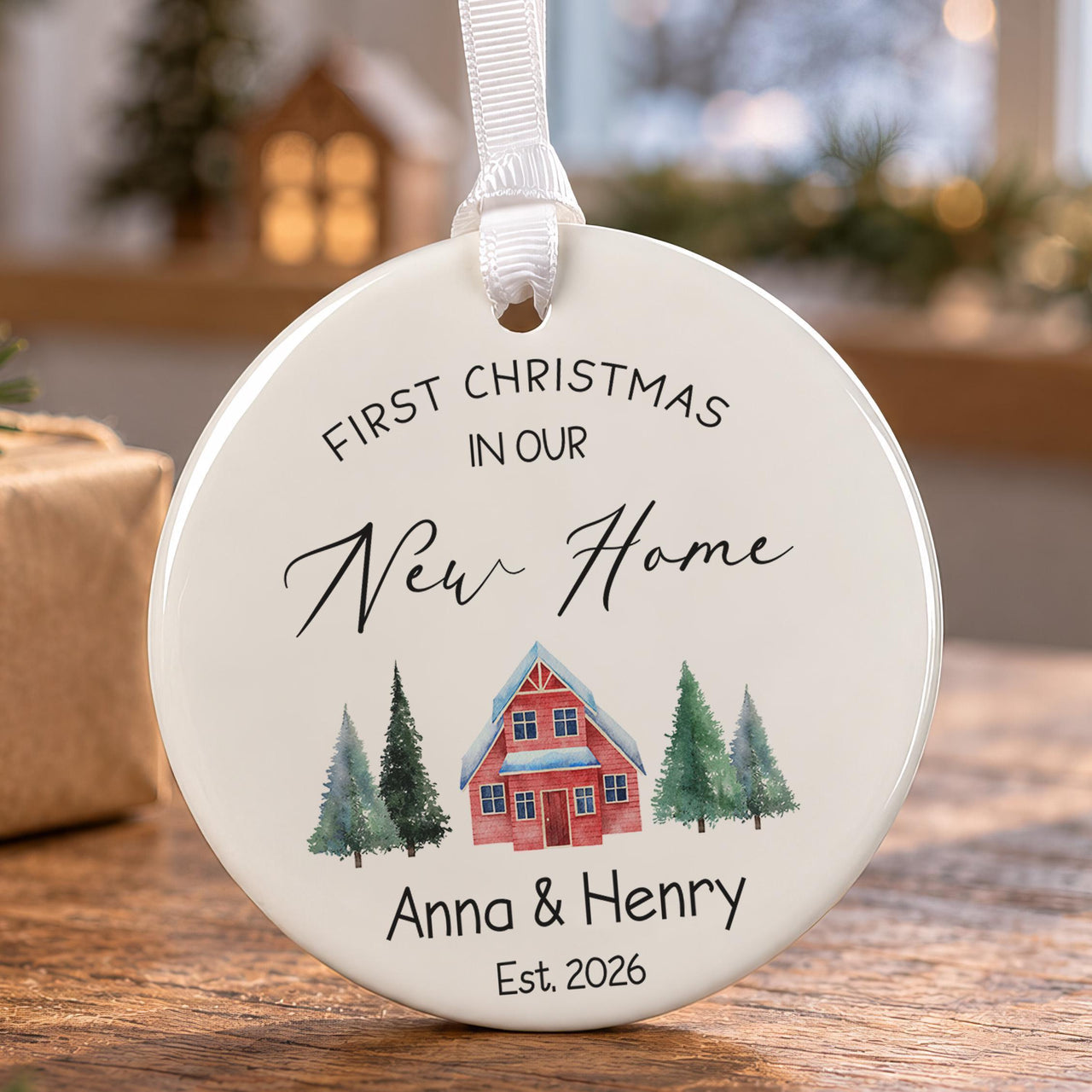 New home ceramic ornament: red house between green pine trees, First Christmas in Our New Home, Anna & Henry, 2026