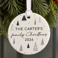 Family name ceramic bauble with grey and navy doodle trees and dots: The Carter's family Christmas 2026, hung on pine