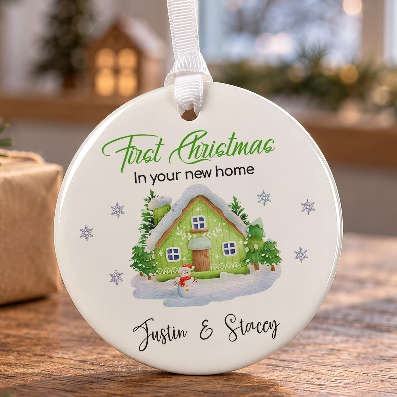 New home ceramic bauble: round, green snowy cottage with snowman, First Christmas In your new home, Justin & Stacey