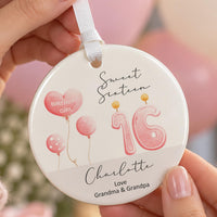 Sweet sixteen ornament: ceramic disc with pink balloons, a 16 candle and the name Charlotte, Love Grandma & Grandpa