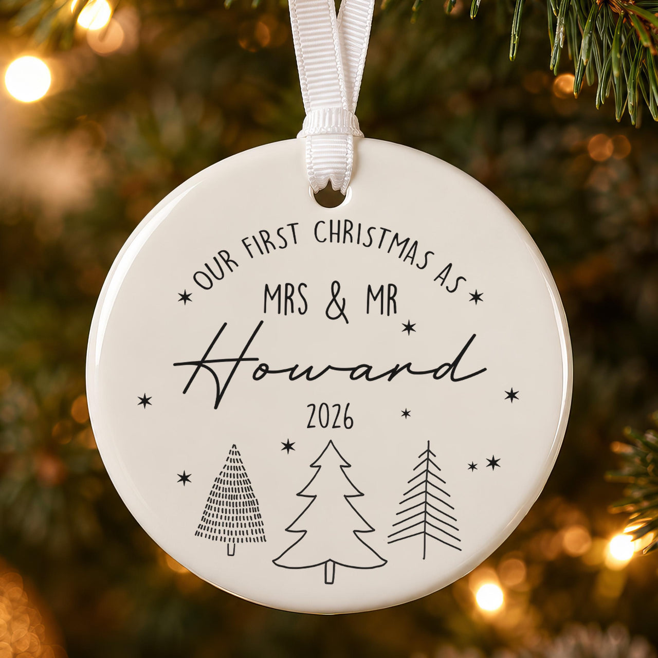 First Christmas married bauble: ceramic ornament with three line-art trees, stars and Mrs & Mr Howard 2026