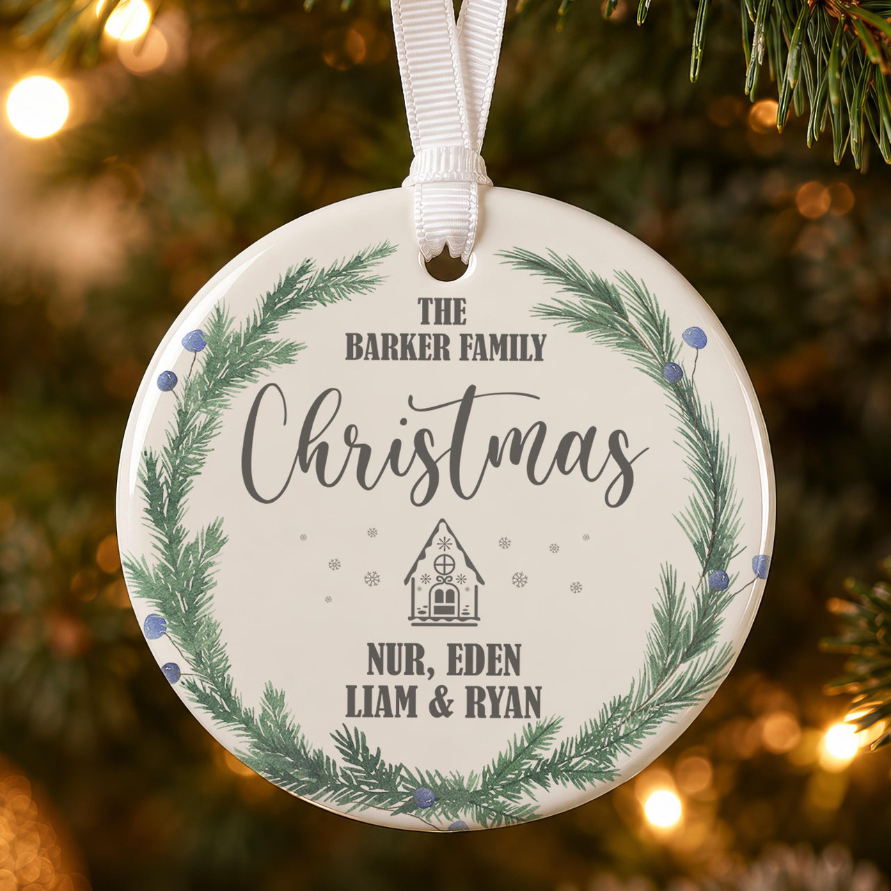 Family name ceramic bauble: pine wreath with blue berries, The Barker Family Christmas, Nur, Eden, Liam & Ryan