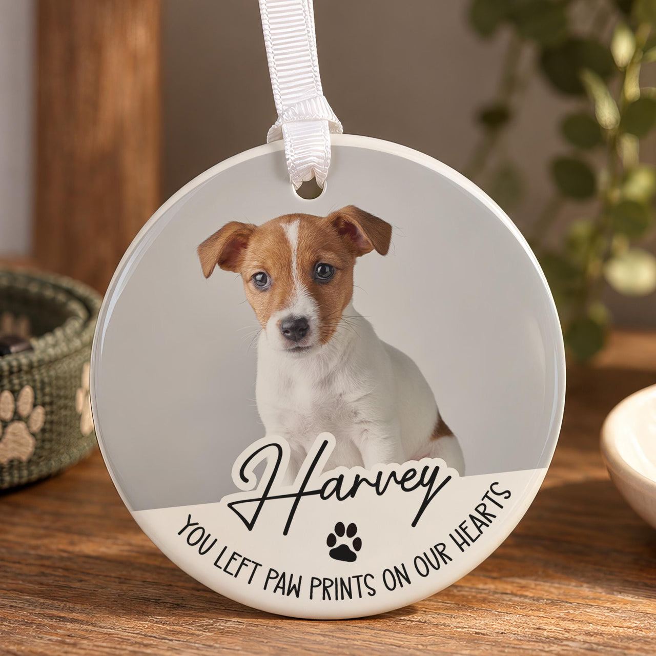 Pet memorial ceramic ornament with a photo of a brown and white puppy, Harvey, You left paw prints on our hearts