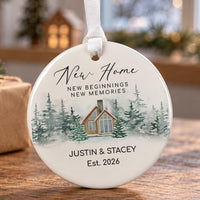 New Home ceramic bauble: snowy wooden cabin among pine trees, New beginnings new memories, Justin and Stacey, Est. 2026
