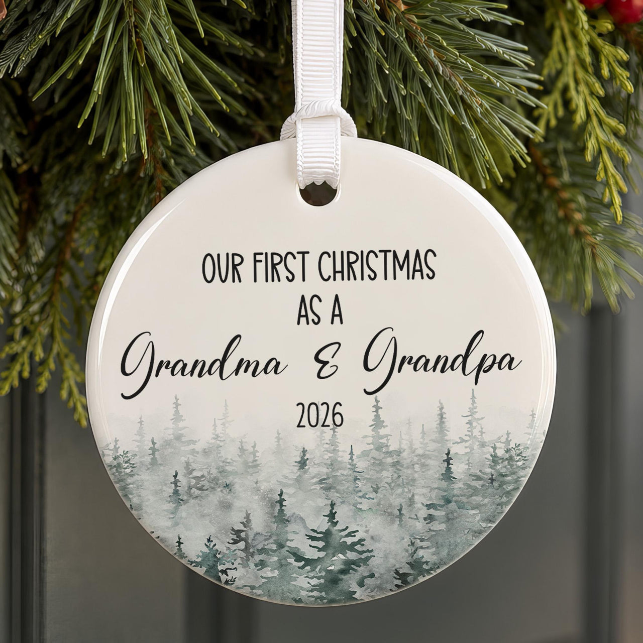 Personalised grandparents bauble: round ceramic ornament with misty watercolour pine forest and Grandma & Grandpa 2026