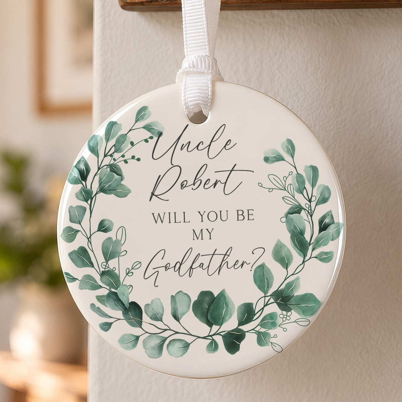 Godfather proposal ceramic bauble: green eucalyptus wreath around Uncle Robert, Will You Be My Godfather? in script