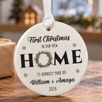 First Christmas in our new home bauble: ceramic ornament with a holly wreath as the O in HOME, address, names and 2026