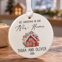 New home Christmas bauble: ceramic ornament with a watercolour red house among poinsettias and Tasha and Oliver 2026