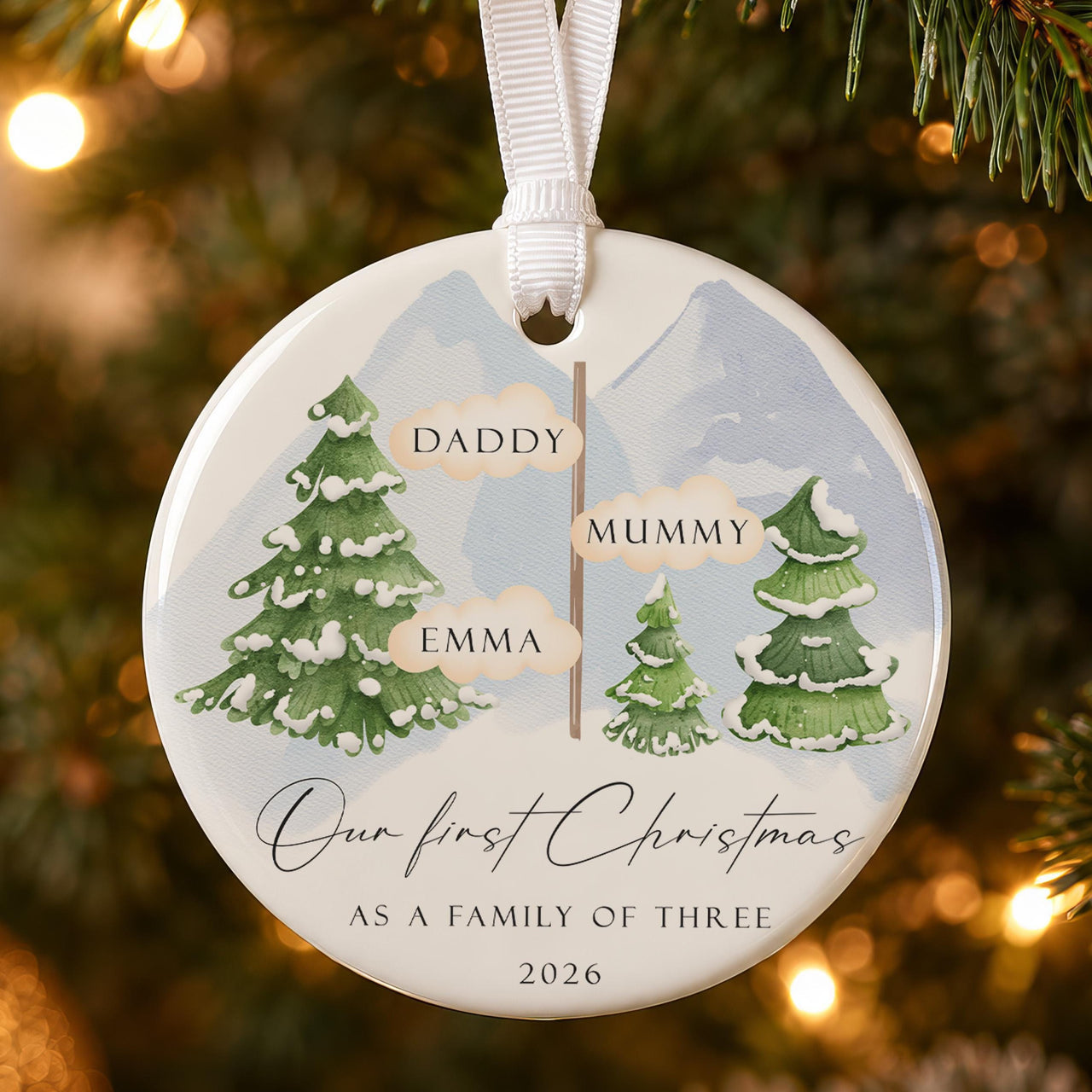 Family of three ceramic bauble: snowy pines and signpost with Daddy, Mummy, Emma, Our First Christmas, 2026