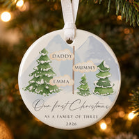 Family of three ceramic bauble: snowy pines and signpost with Daddy, Mummy, Emma, Our First Christmas, 2026