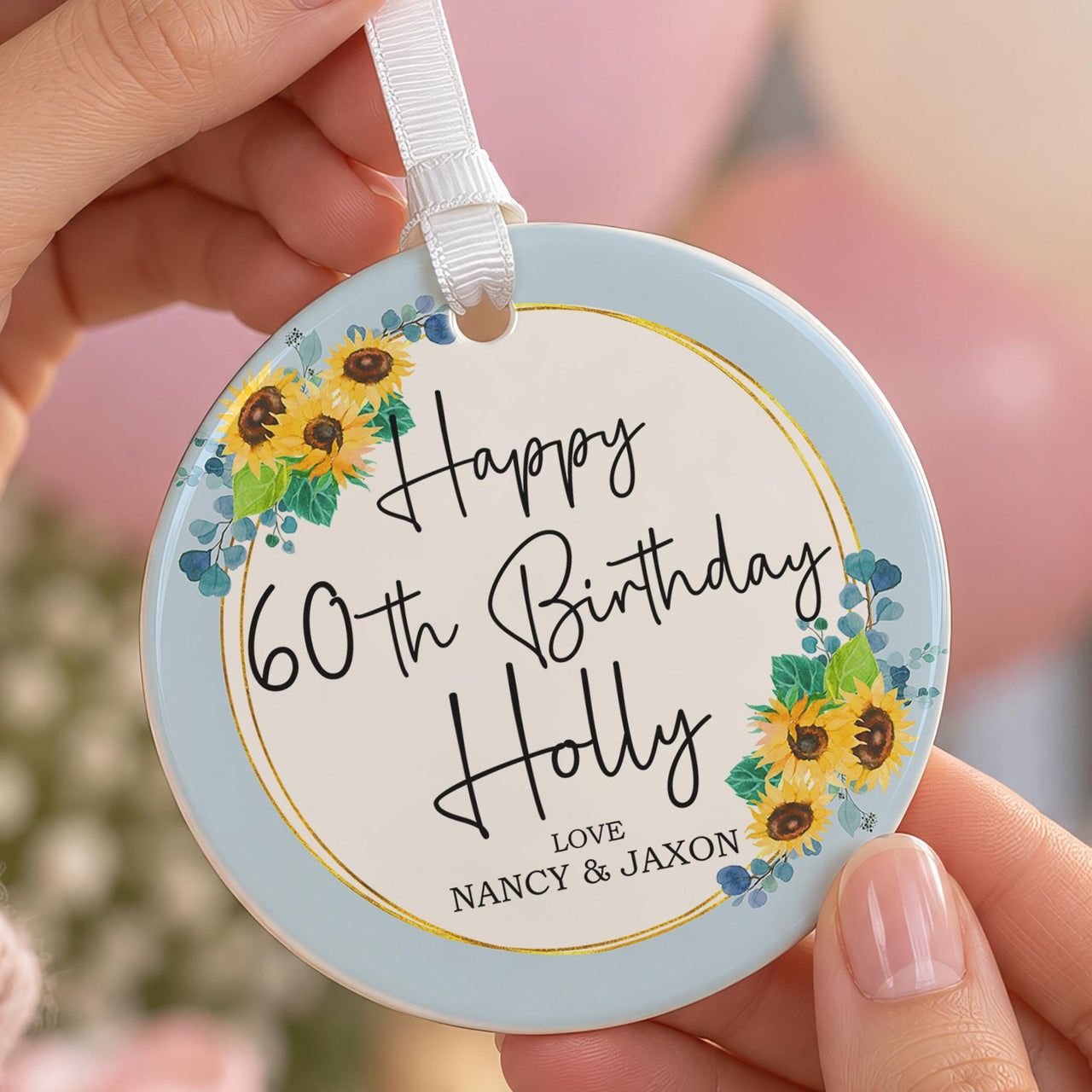 60th birthday ornament: ceramic disc with sunflowers, gold ring, Happy 60th Birthday Holly and Love Nancy & Jaxon