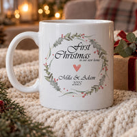 Personalised new home mug: white mug with a holly wreath, First Christmas in our new home, a heart, Mila & Adam and 2025