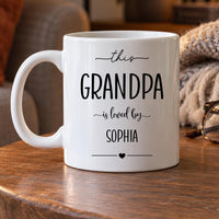 Personalised grandpa mug: white mug reading this GRANDPA is loved by SOPHIA in black lettering with a small heart
