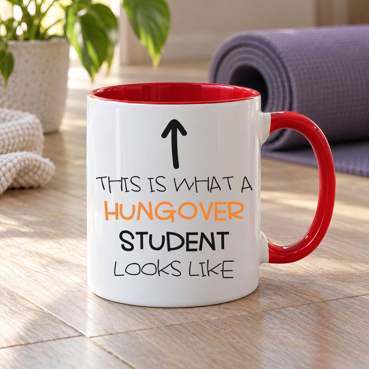 Funny student mug: white mug with red handle, an up arrow and THIS IS WHAT A HUNGOVER STUDENT LOOKS LIKE
