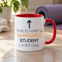 Funny student mug: white mug with red handle, an up arrow and THIS IS WHAT A HUNGOVER STUDENT LOOKS LIKE