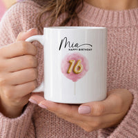 Personalised 16th birthday mug: white mug with the name Mia, HAPPY BIRTHDAY and a gold 16 on a pink watercolour balloon
